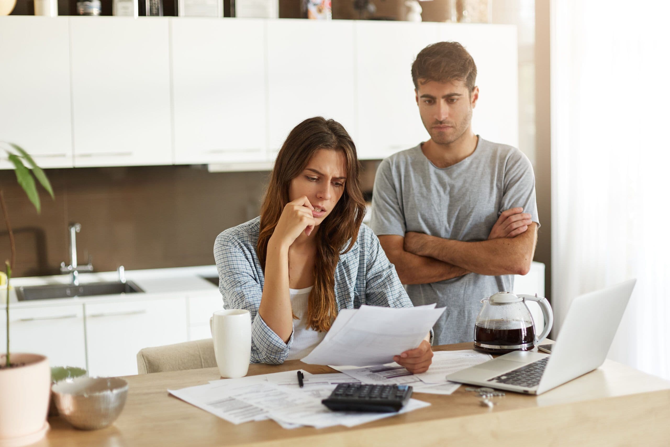 Candid_shot_of_young_American_man_and_woman_dressed_casually_feeling_stressed_while_managing_finance_075d262b10.jpg